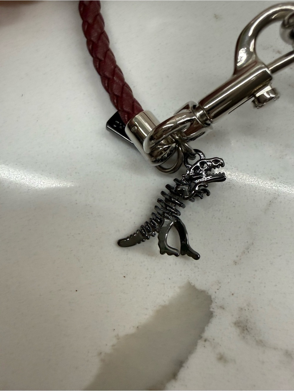 Coach Braided brown  Bracelet with Dinosaur Skeleton Charm